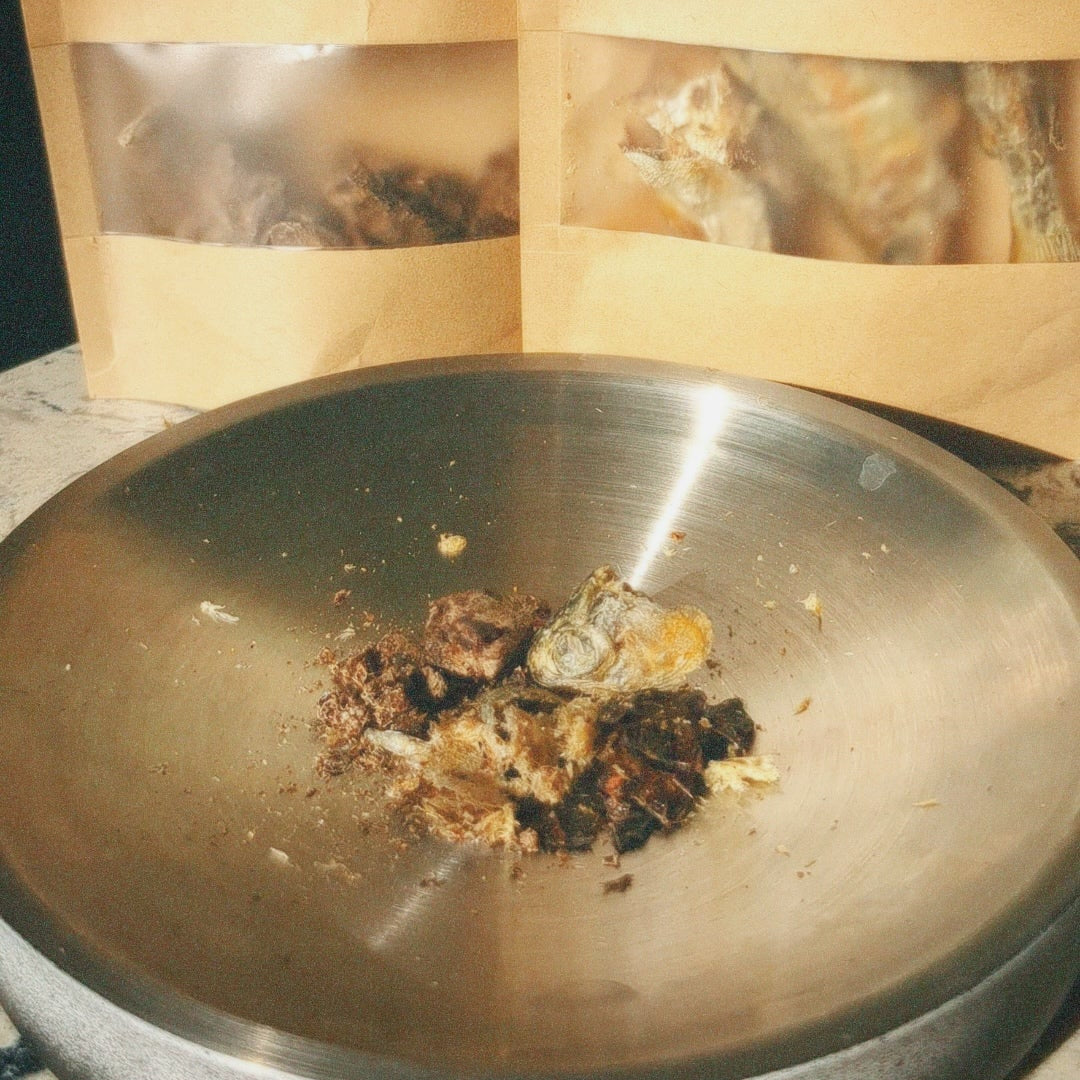 cat treatos in a metal bowl with treatos box packaging in the background